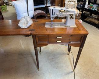Singer, sewing machine and cabinet
