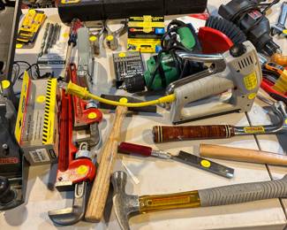 Staples, pipe wrench, drills, sanders, polishers
