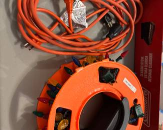 Wheel holder for lights or hose