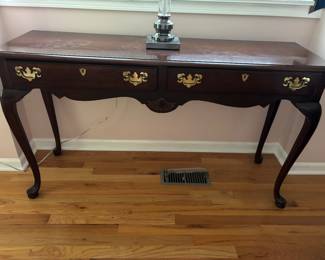 Mahogany Queen Anne and brass sofa table with curved apron.