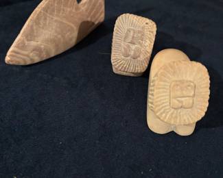Soapstone carvings of fish and lions