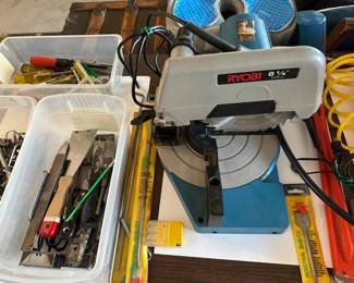 Ryobi compound miter saw, double insulated , scrapers and cutters, hex keys, drill bits, screwdrivers