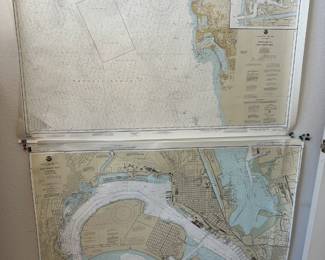 Huge maps charting San Diego Bay, with holder