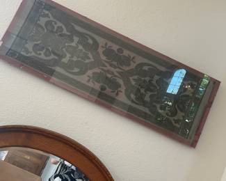 Hard to see with reflection but textile art well framed