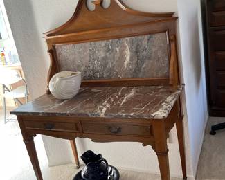 Marble top washstand with split scroll top detail