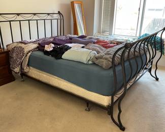 Queen bed has curved metal frame, mattress compromised you can take or leave, assorted bedding