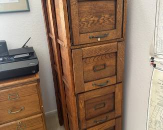 Four drawer wood file cabinet as is, wood pieces missing on some sides, but great design
