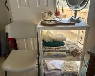 Fold up outdoor chair, bathroom items, incomplete sheet sets