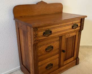 Oak cabinet with hat box holder