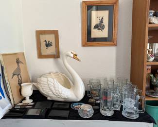 Big sassy swan sails into beer mugs, fowl play!
