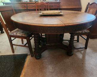54" round table with 4 mismatched Oak chairs-2 leafs
