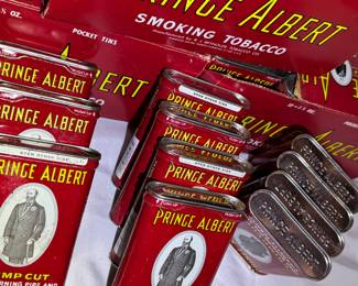 Rare trove of approximately 25 Prince Albert, vintage tobacco tins, unopened and found in mint condition with original rolling papers.