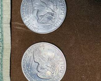 US silver certificate and two Eisenhower dollar coins