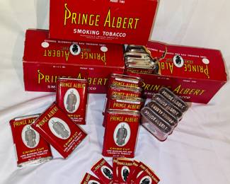 Rare trove of approximately 25 Prince Albert, vintage tobacco tins, unopened and found in mint condition with original rolling papers.
