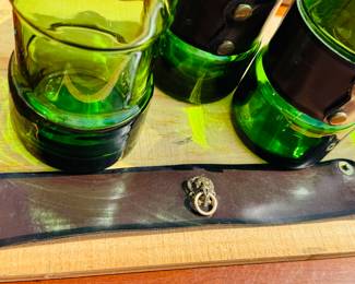 mid-century modern emerald green glass tumblers with leather and brass lion head removable wrap.