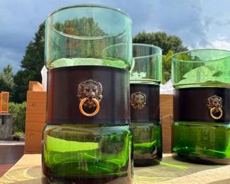 mid-century modern emerald green glass tumblers with leather and brass lion head removable wrap.
