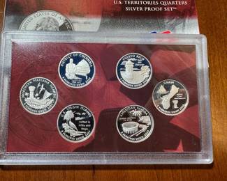 six piece silver collectible US quarter set.
key date 2009 series depicting the US territories