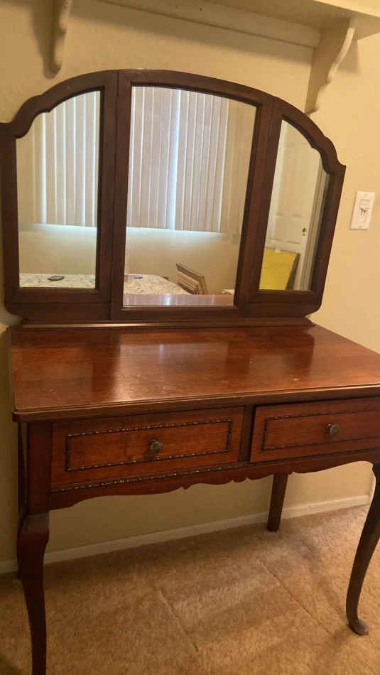 A Beautiful Womans Vanity With Attached Mirror And Two Drawers