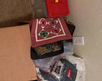 Sewing Supplies And A Box Full Of Material Pieces 