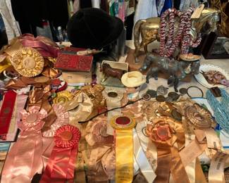 vintage equestrian ribbons medals, horse trophies and horse decor, books , fancy bits ,some odds and ends tack.