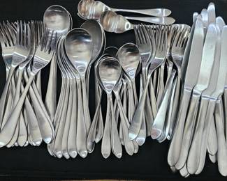 84 piece Robert Welch Meridian flatware set.  Full service for 16