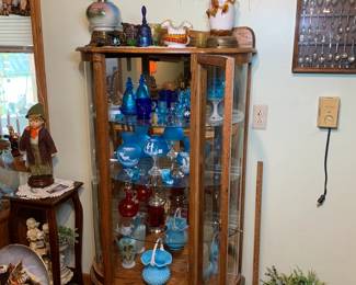 Display case filled with nice glass pieces including Stevens & Williams, Westmoreland, Imperial, Mosser, and Fenton. 