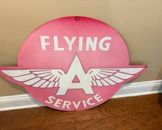 Old Flying A service sign that has faded to pink