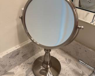 Simple Human sensor lighted makeup vanity mirror in stainless.