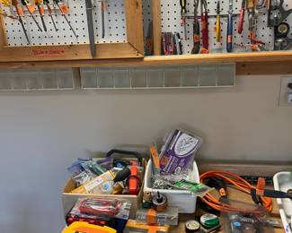Tools!  NO the Cabinet is attached to house and not for sale.  The bench however IS for Sale!