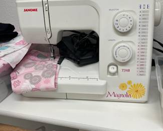 Stitches well, give it a try.  There is also a sewing table available. 