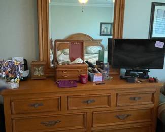 Drexel Heritage bedroom suite includes dresser with mirror, king bed, nightstand and amoire with shelves and drawers. 