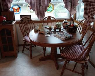 dining table and chairs, stained glass light catchers, cookie jars
