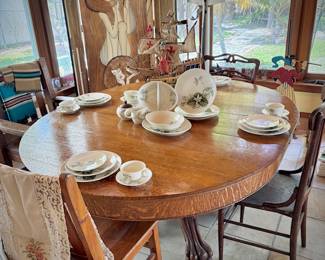 Antique oak dining table with leaf and double clawed feet
