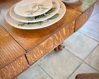 Antique oak dining table with leaf and double clawed feet