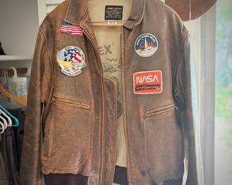 Men’s clothing, including US Navy leather bomber jacket