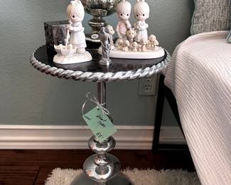Silver Side Table and decor, including Precious Moments figurines.
