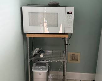 Kitchen items — microwave, utility cart, countertop icemaker