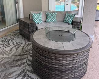 Outdoor seating with fire table and outdoor rug