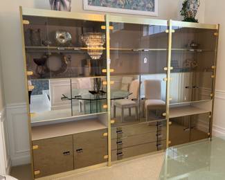 Brush gold, mirror, and lucite cabinet. Very vintage.