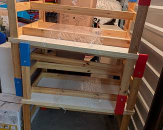 A fantastic set of sturdy, high-quality wooden activity tables, each approximately 2 feet tall x 3 feet long x 2 feet deep. Featuring durable construction with colorful (red & blue) accents, these tables are perfect for various learning stations, art projects, group activities, or mealtimes in a preschool, homeschool, or child's playroom.   We have 5