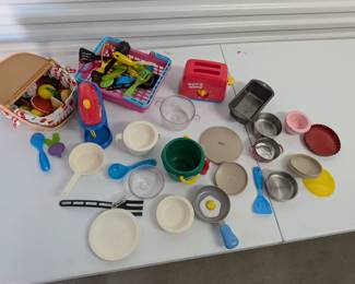 A comprehensive and engaging set of play kitchen accessories and food items, perfect for imaginative dramatic play in a classroom, homeschool, or playroom setting. This large collection includes a toy toaster, mixer, various metal and plastic pots & pans, dishes, utensils, and assorted play food. Encourages social skills, creativity, and fine motor development