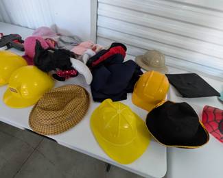 Unleash imagination with this fantastic assortment of children's hats, ideal for dramatic play, costumes, and role-playing! This fun collection includes sturdy hard hats (some Little Tikes brand), a graduation cap, a pirate hat, a Spider-Man mask/hat, and various other character and everyday hats. Perfect for sparking creativity in a classroom, homeschool, or home play area.
