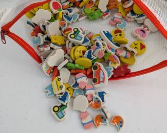  A large collection of small, colorful erasers or foam figurines in assorted shapes (emojis, cars, food, animals, etc.). Fantastic for counting, sorting, sensory bins, craft projects, or as classroom rewards.