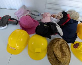 Unleash imagination with this fantastic assortment of children's hats, ideal for dramatic play, costumes, and role-playing! This fun collection includes sturdy hard hats (some Little Tikes brand), a graduation cap, a pirate hat, a Spider-Man mask/hat, and various other character and everyday hats. Perfect for sparking creativity in a classroom, homeschool, or home play area.