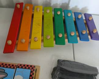 A vibrant wooden xylophone, perfect for introducing young children to music, rhythm, and color recognition. Promotes fine motor skills and auditory development through play.