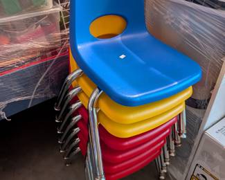  A collection of sturdy, brightly colored (red, yellow, blue, etc.) child-sized chairs, built for the rigors of a classroom setting. Featuring durable plastic seats and backs with strong metal legs, these chairs are stackable for easy storage. Perfect for preschools, homeschools, playrooms, or kids' activity tables.