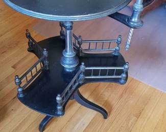 Ebonized swivel reading table.
