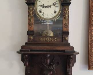 Clock and Black Forest carved shelf. Clock runs w/key.