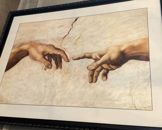 Framed print of Michelangelo's "Creation of Adam."