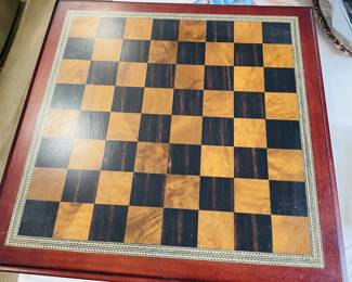 Antique chess table with a decorative border.